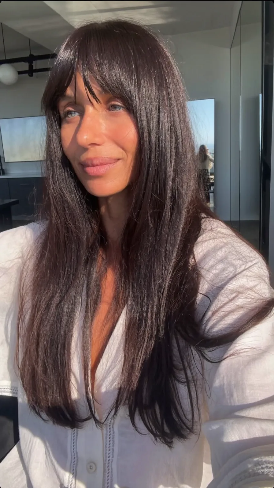 Long Layered Hair with Rich Color and Curtain Bangs