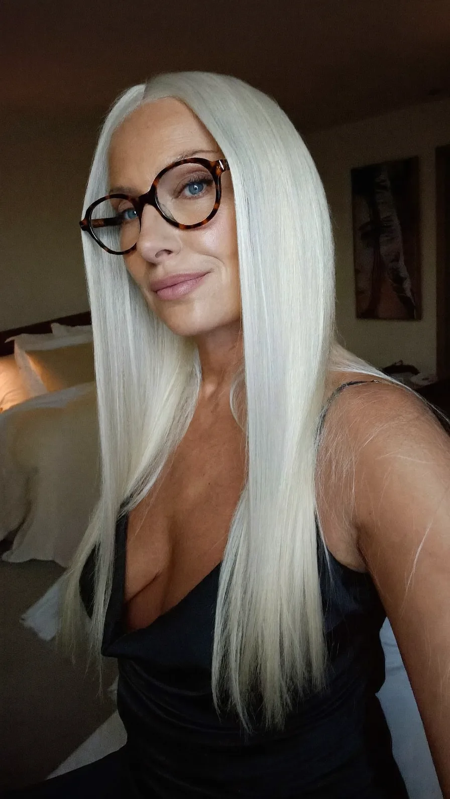 Sleek Platinum White Long Layered Hair with Center Part