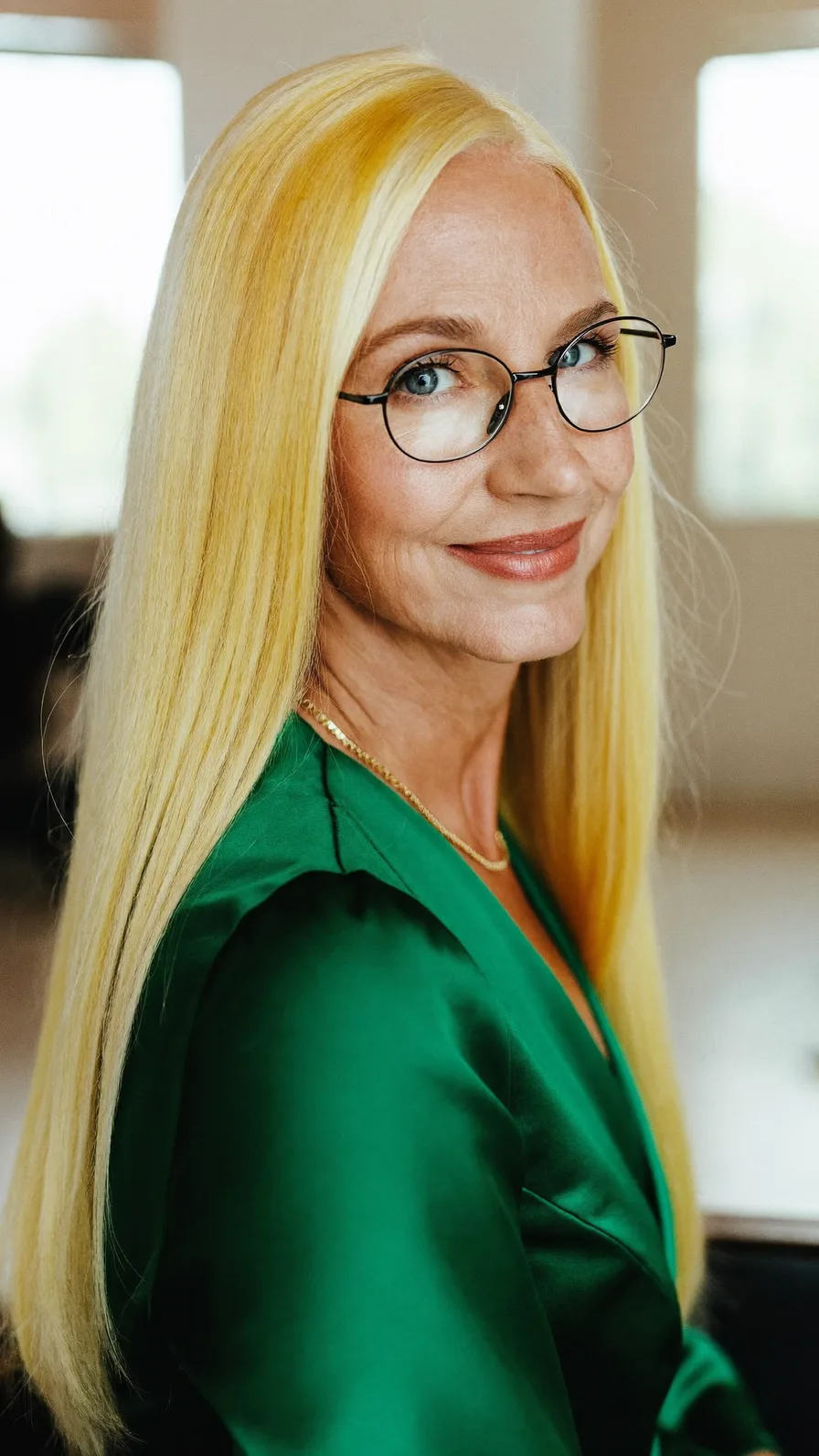 Sleek Long Platinum Blonde Hairstyle with Center Parting