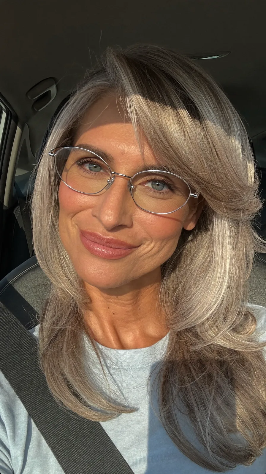 Elegant Silver Ash Blonde Long Layered Hair with Side-Swept Bangs