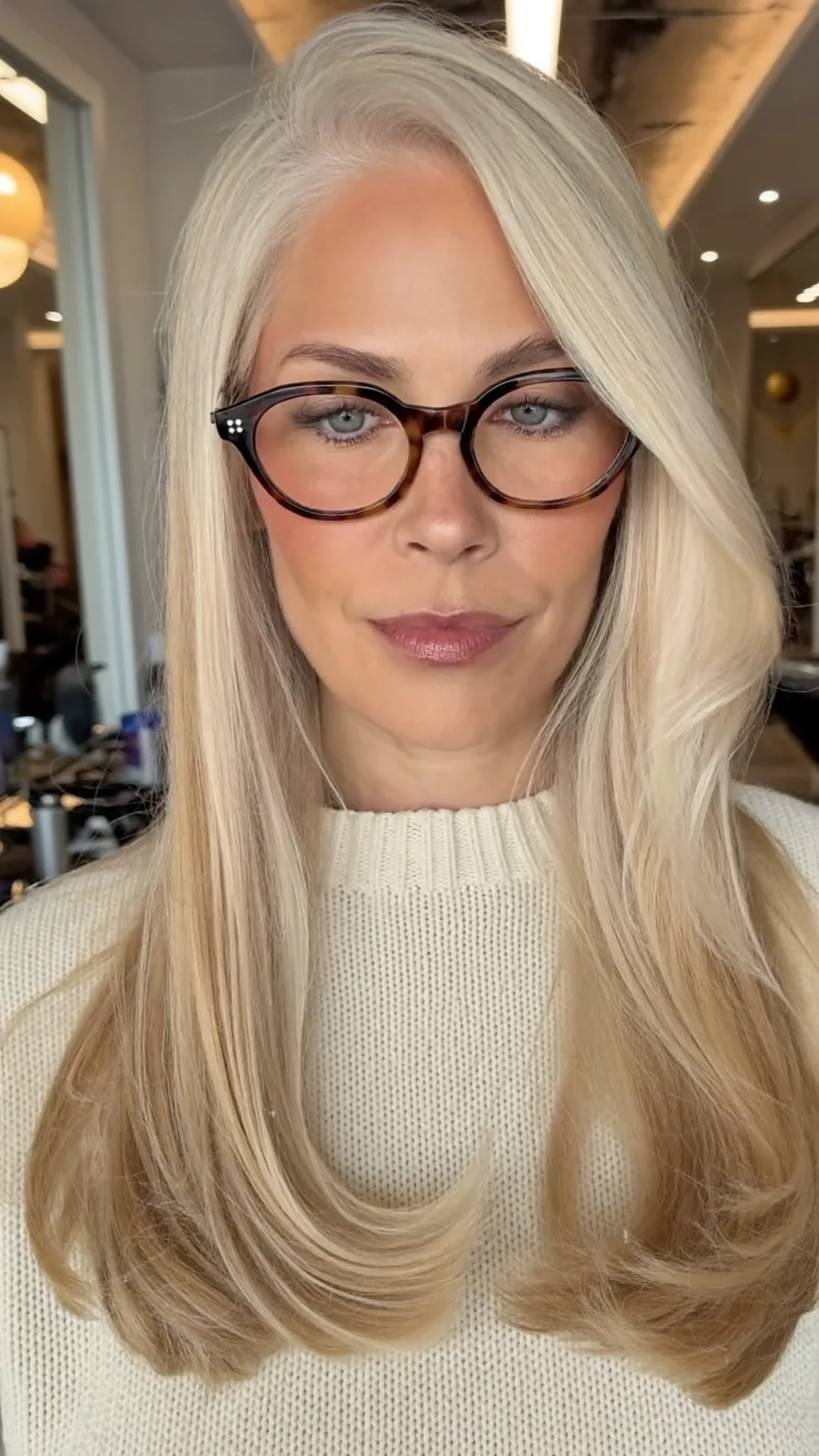 Soft Layered Platinum Blonde Hairstyle with Deep Side Parting