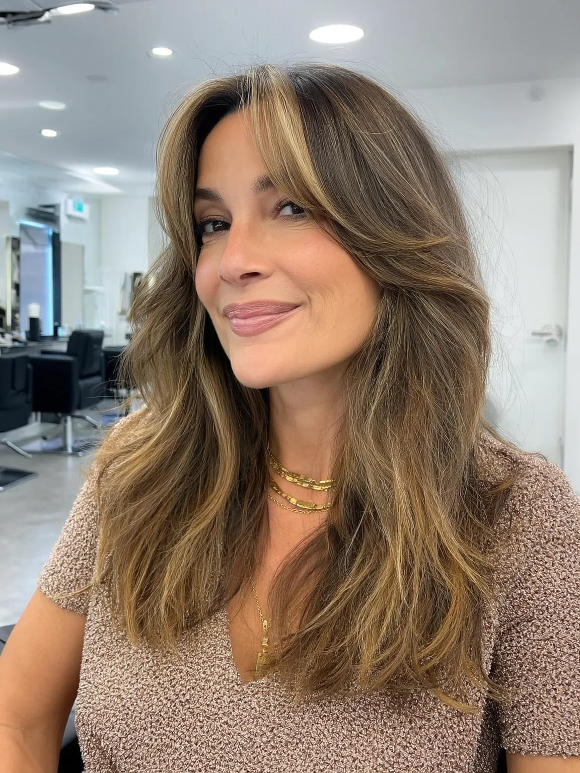 Honey Brown Layered Waves with Curtain Bangs for Oval Faces