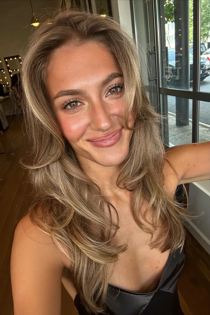 Voluminous Face-Framing Caramel Brown Long Layered Cut