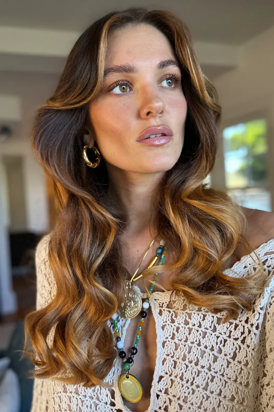 Voluminous Caramel Brown Long Layered Waves with Face-Framing Highlights