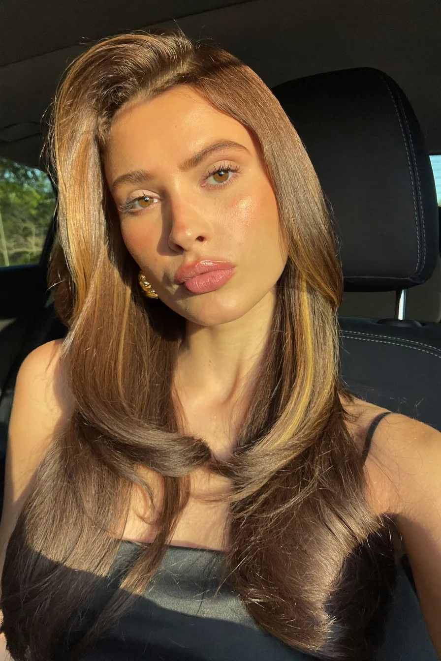 Glossy Caramel Brown Long Layered Hair With Face-Framing Volume