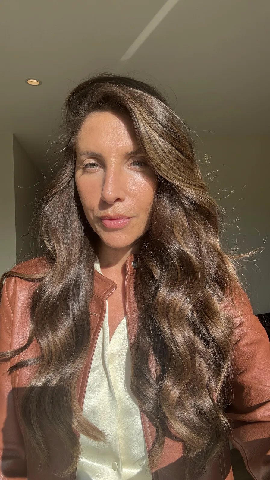 Voluminous Long Layered Waves with Subtle Warm Highlights