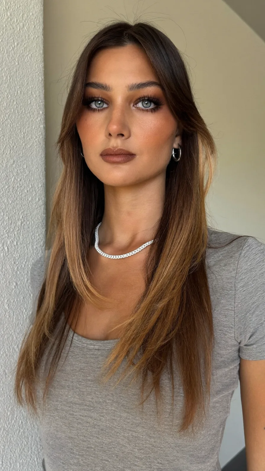 Long Layered Hair with Curtain Bangs and Honey Blonde Balayage