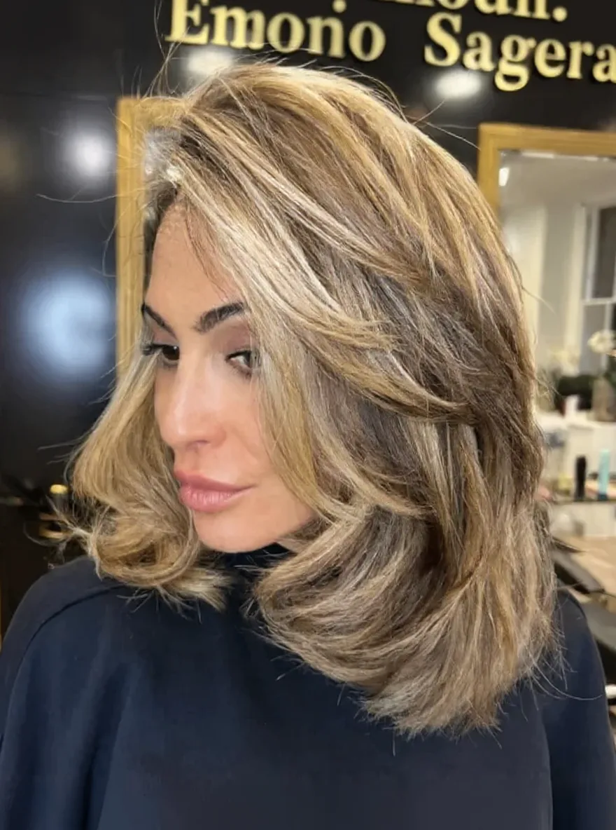 Golden Blonde Balayage Layered Waves with Side-Swept Bangs