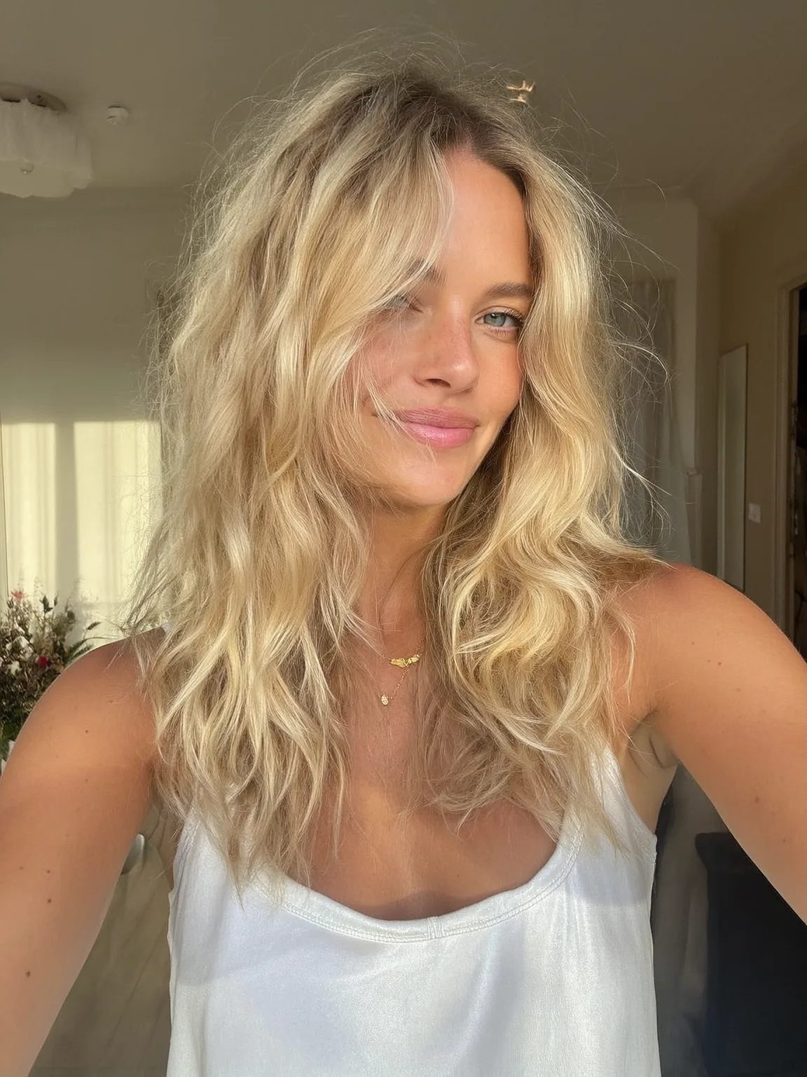 Sun-Kissed Golden Blonde Layers with Curtain Bangs