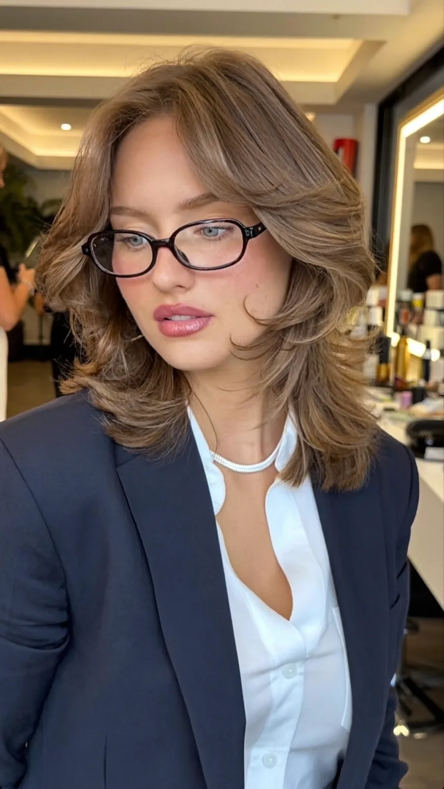 Voluminous Feathered Medium Layers with Soft Curtain Bangs