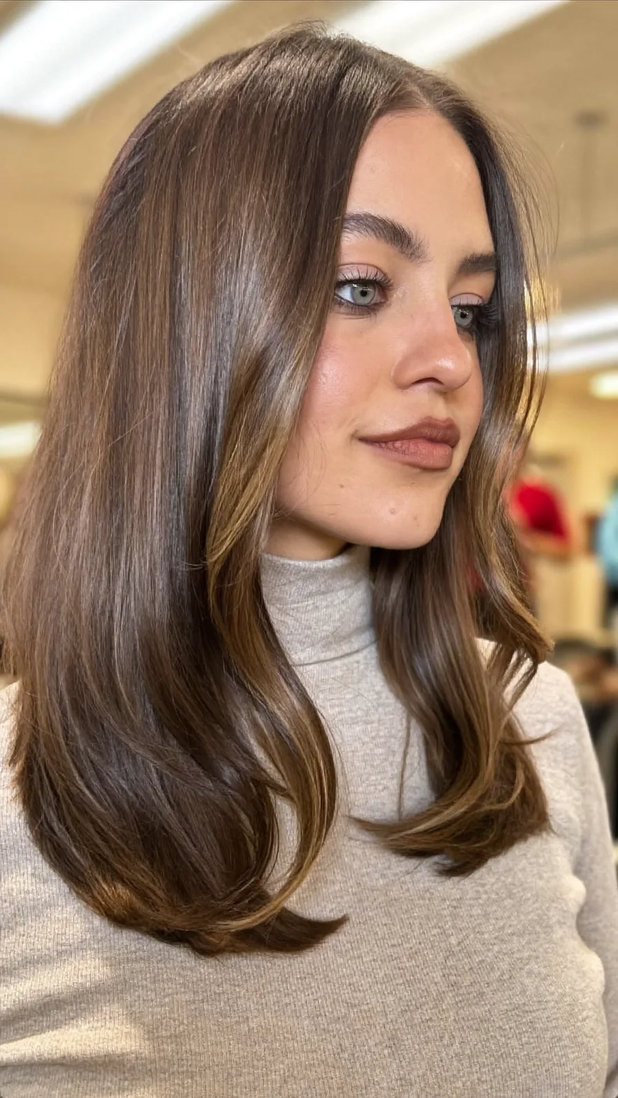 Elegant Medium-Length Layered Hairstyle with Caramel Balayage