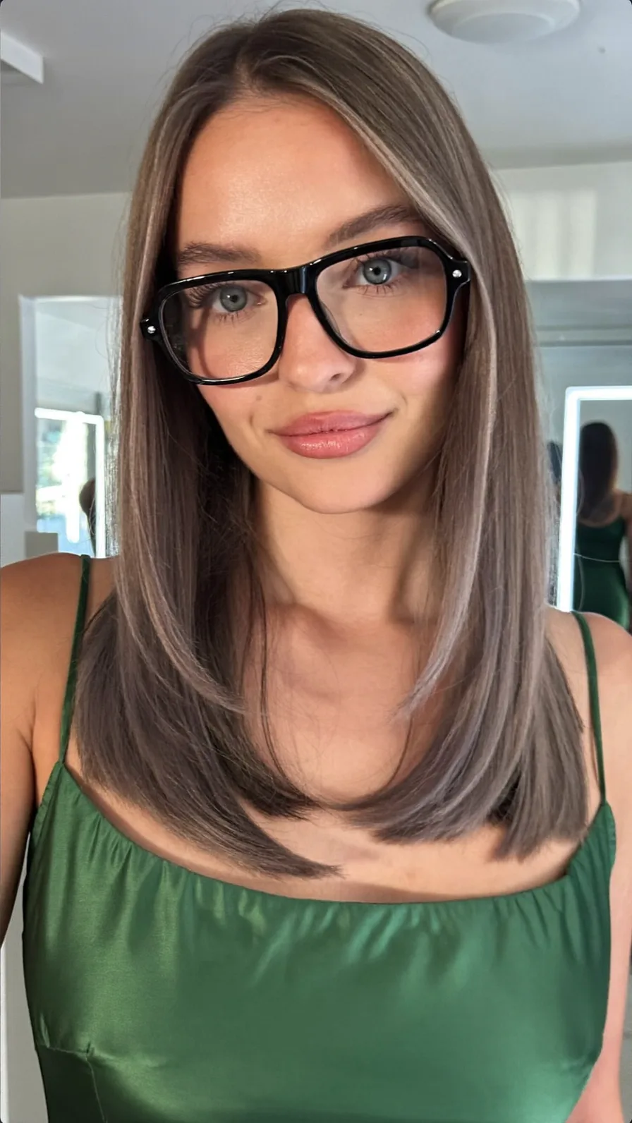 Sleek Medium-Length Ash Brown Hair with Subtle Highlights