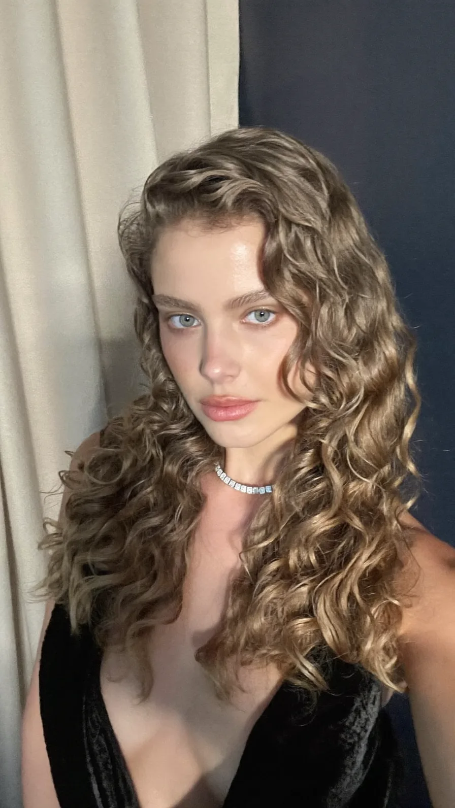 Voluminous Curly Medium Length Hair with Side-Swept Layers