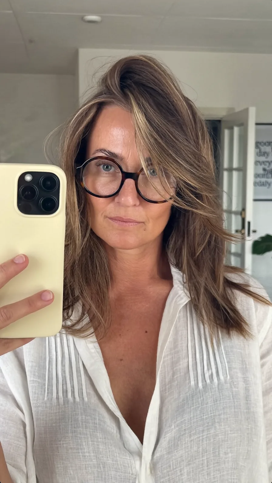 Textured Long Layers with Soft Side-Swept Blonde Highlights