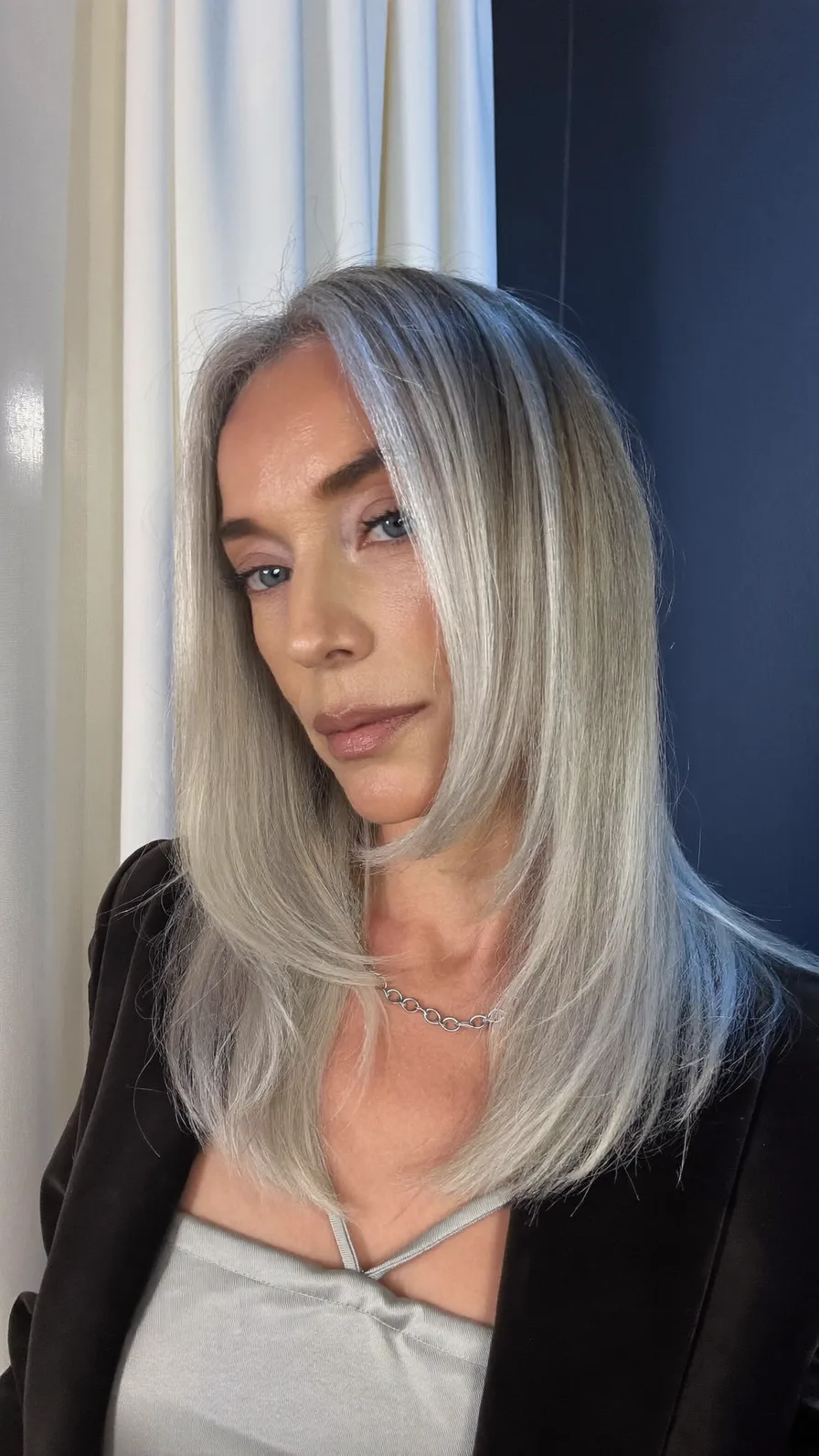 Elegant Medium-Length Silver Blonde with Long Rounded Layers