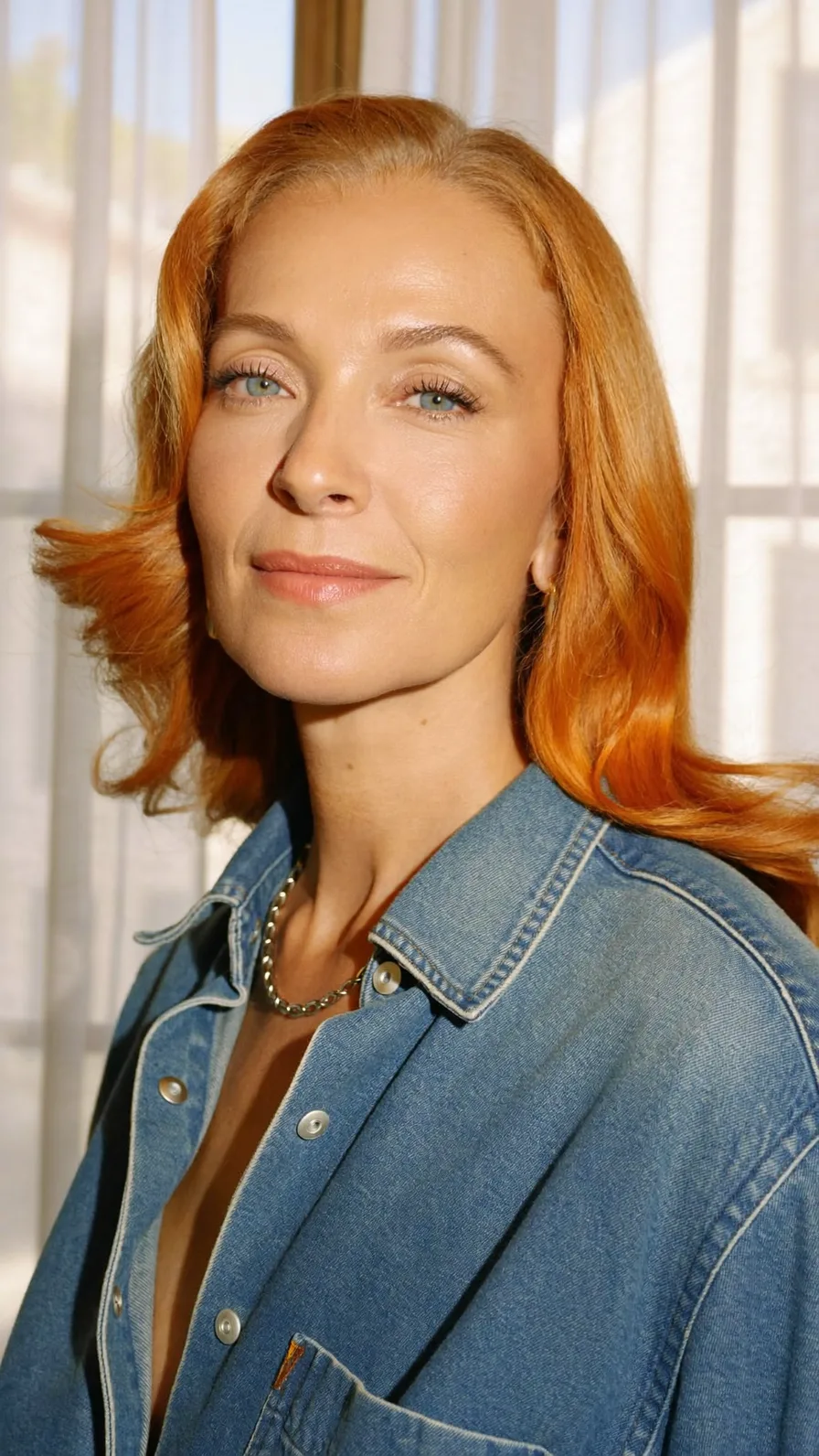 Vibrant Copper Long-Layered Wavy Hairstyle with Flicked Ends