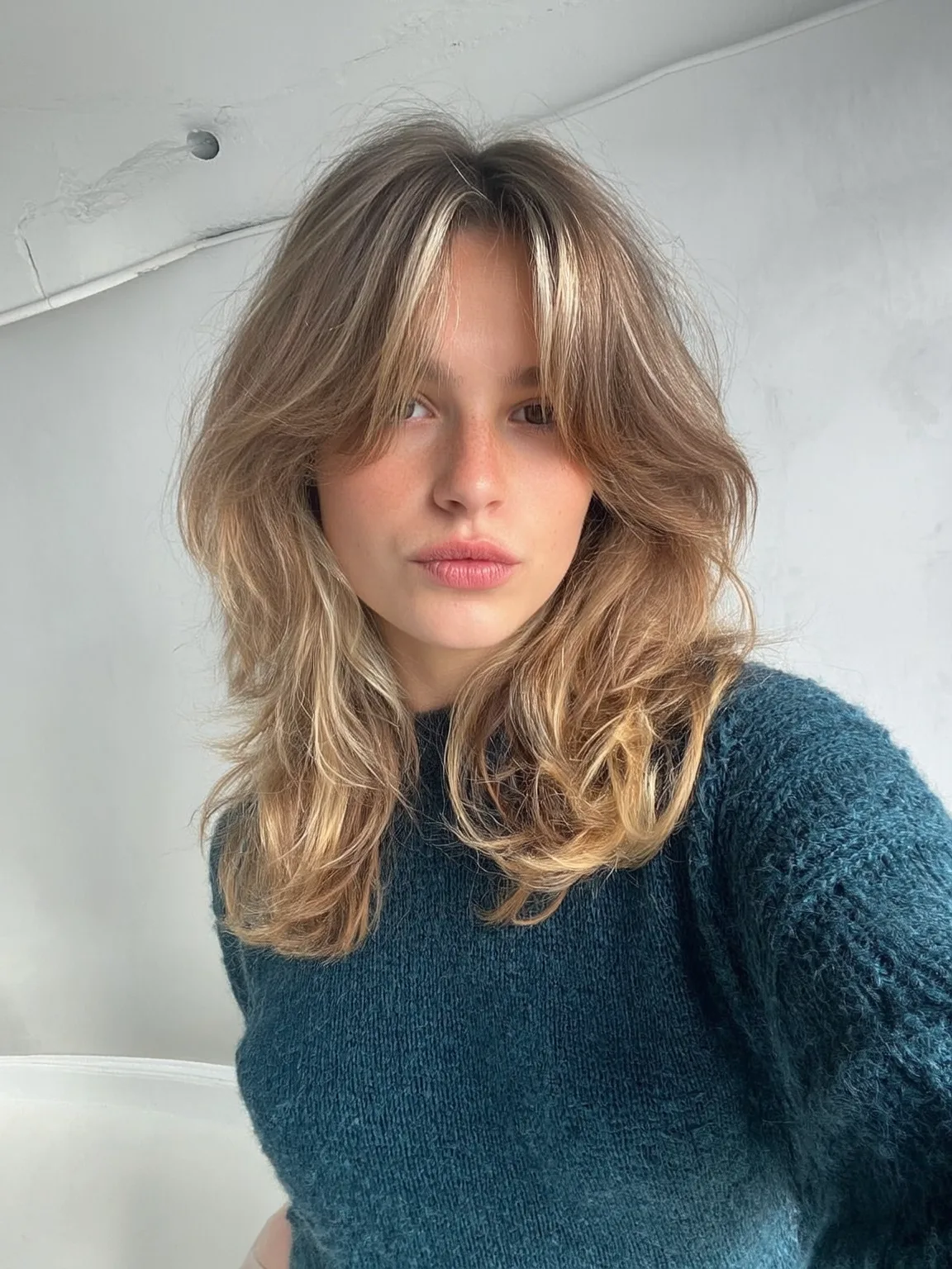 Wavy Sandy Blonde Shag with Curtain Bangs