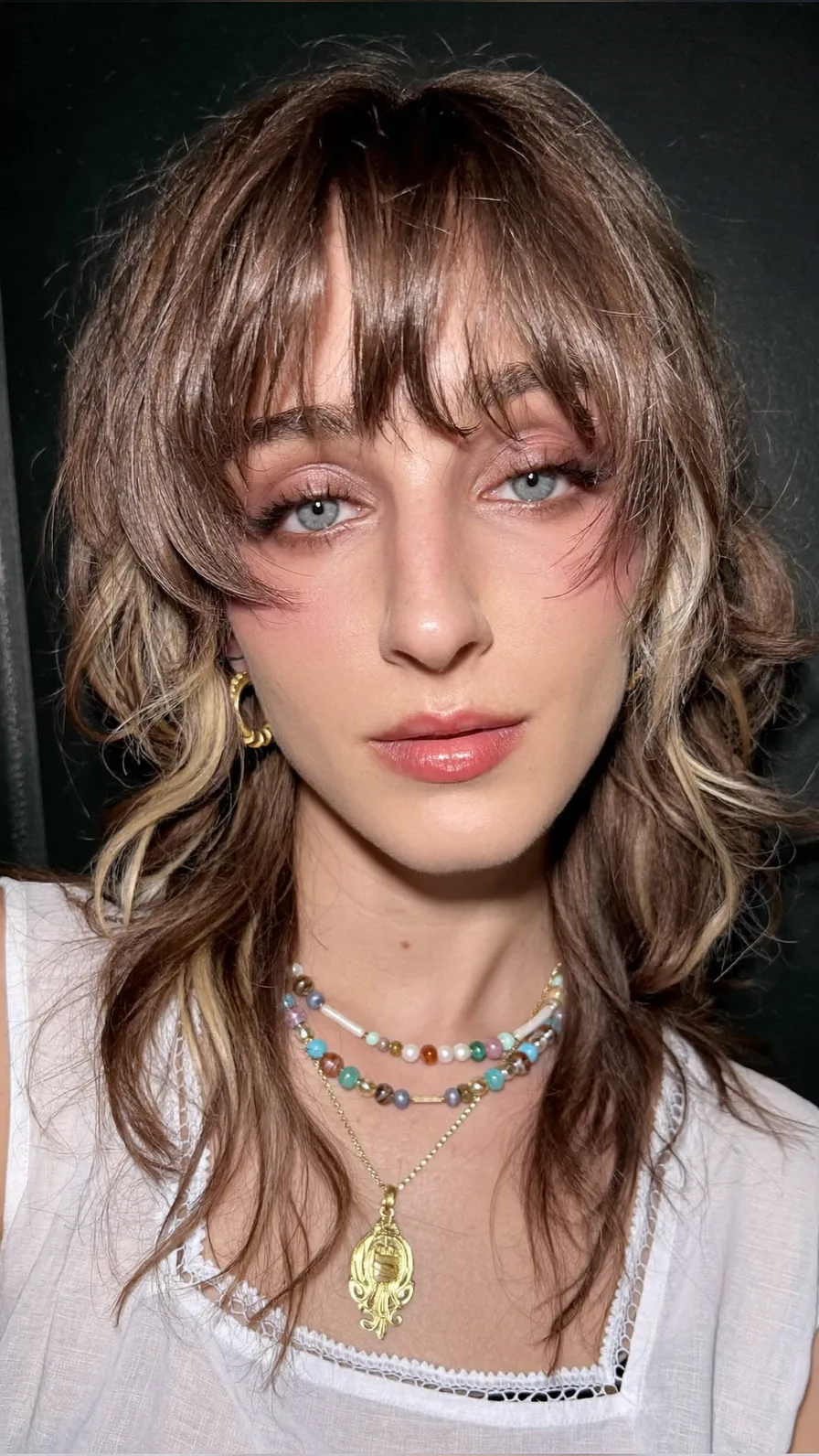 Modern Textured Shag with Curtain Bangs and Blonde Highlights