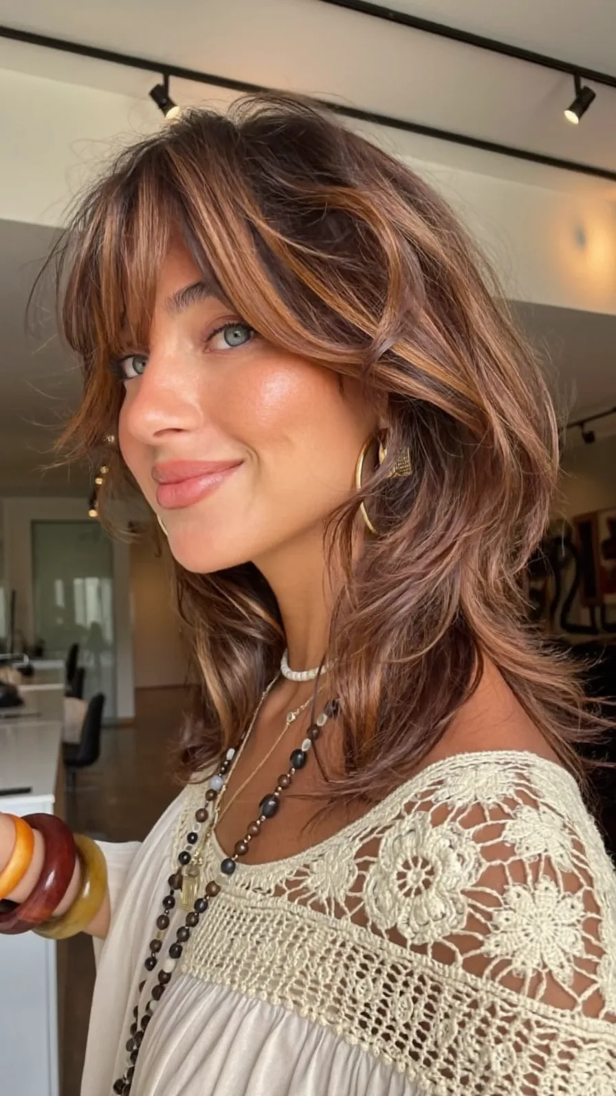 Modern Voluminous Shag with Warm Caramel Balayage Highlights