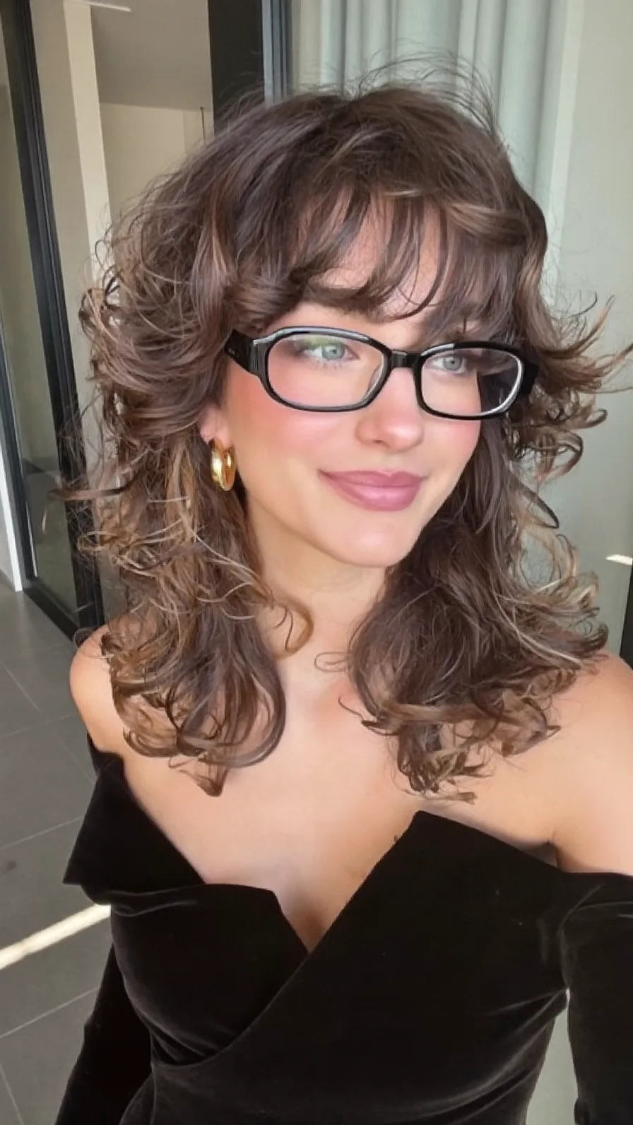 Voluminous Layered Shag Style with Curtain Bangs and Balayage Highlights