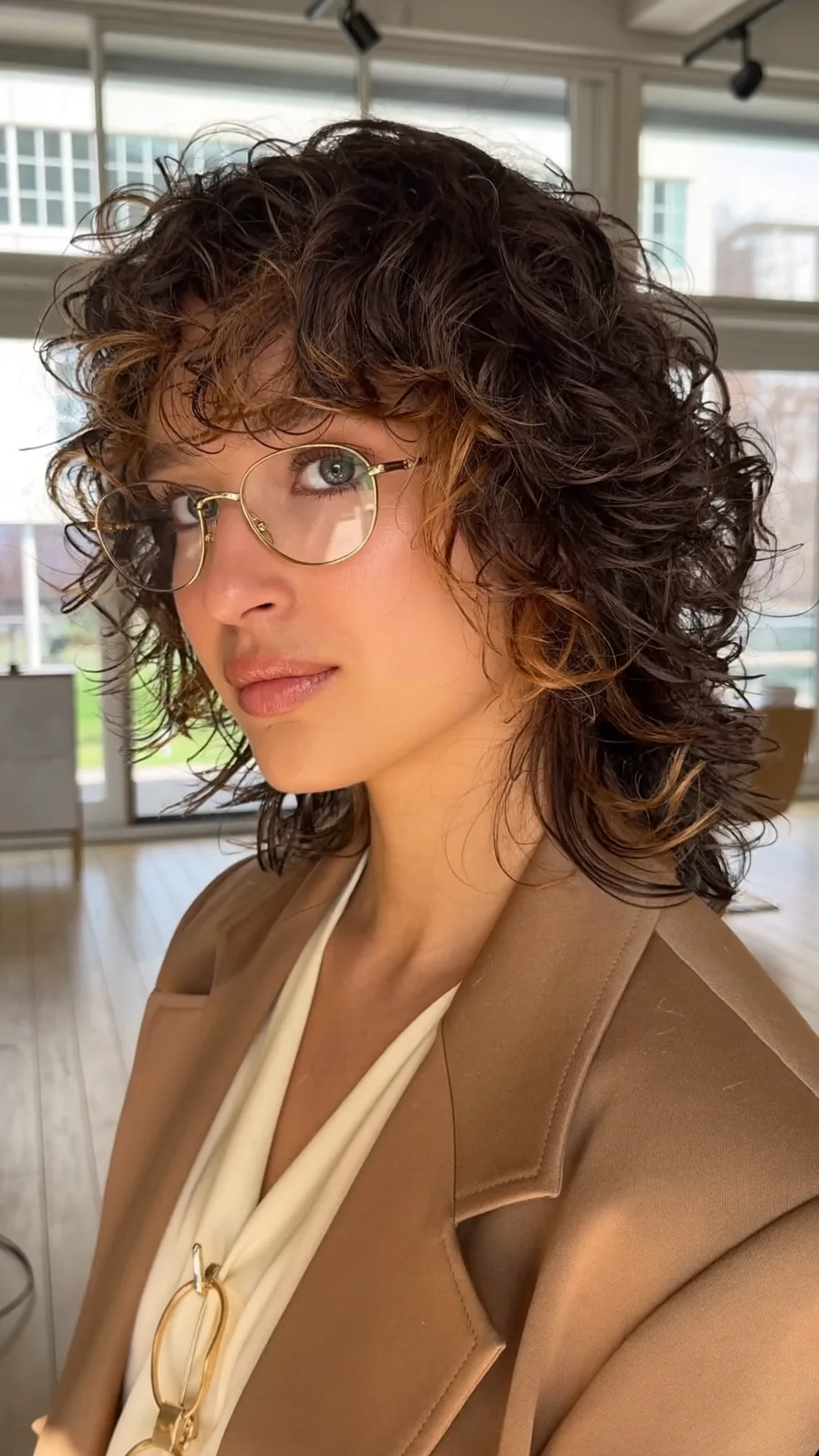 Modern Curly Shag with Curtain-Bangs and Caramel Accents