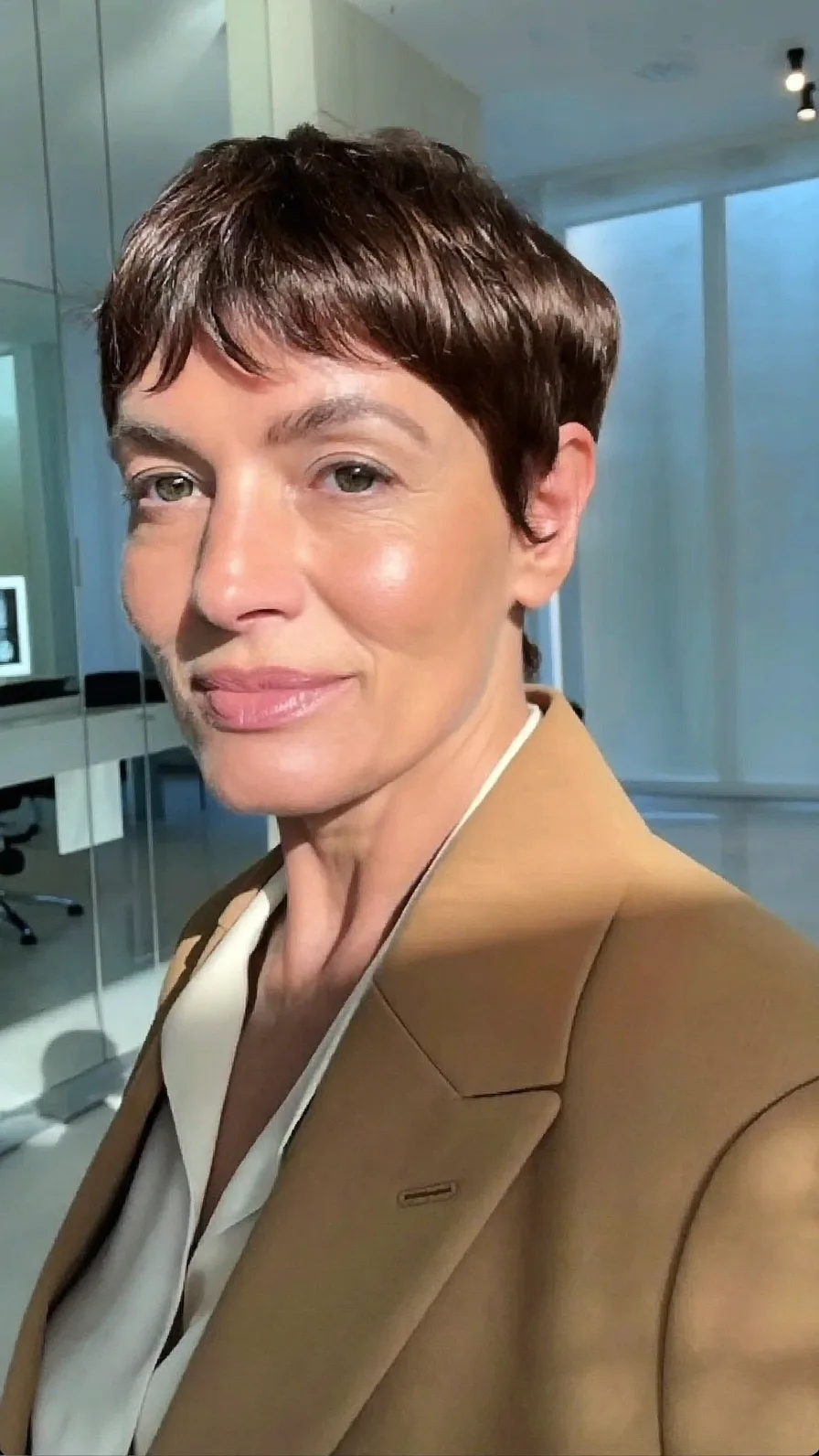 Elegant Dark Chocolate Pixie Cut with Micro Bangs for Oval Faces