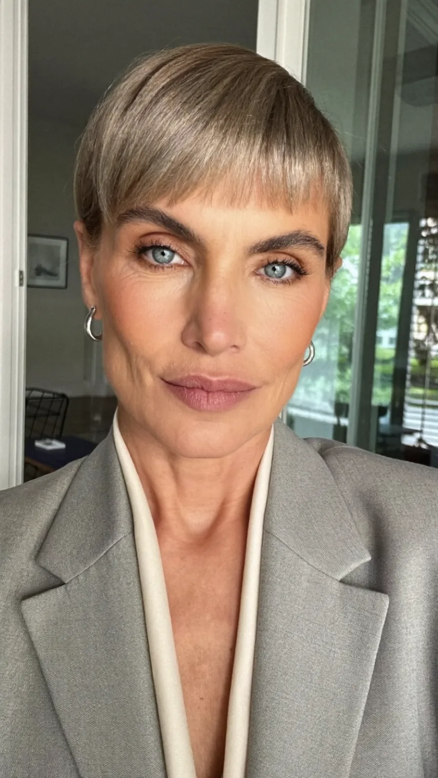 Sleek Ash Blonde Pixie with Micro Bangs and Blunt Cut