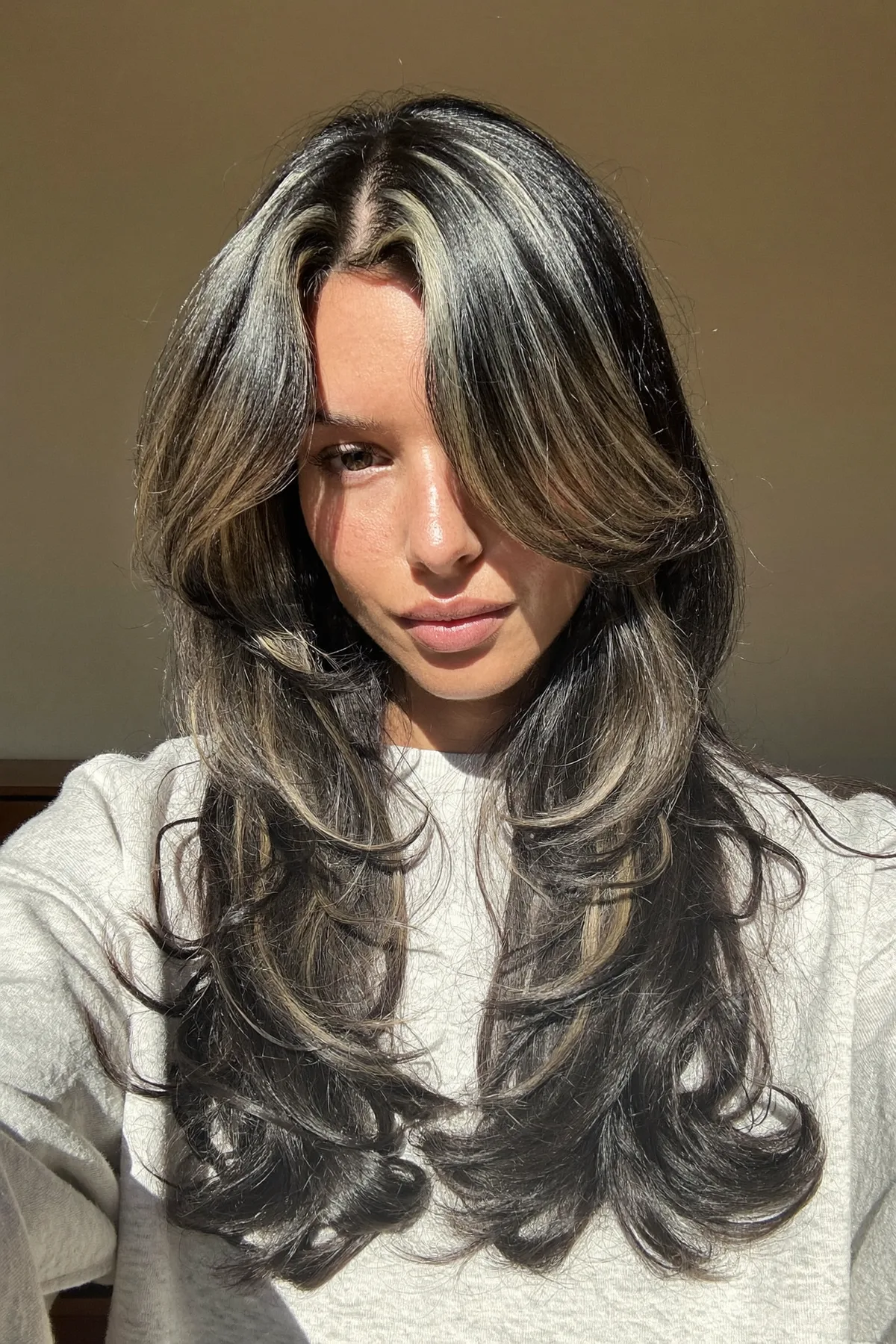 Jet Black Long Layered Cut with Curtain Bangs and Chunky Highlights