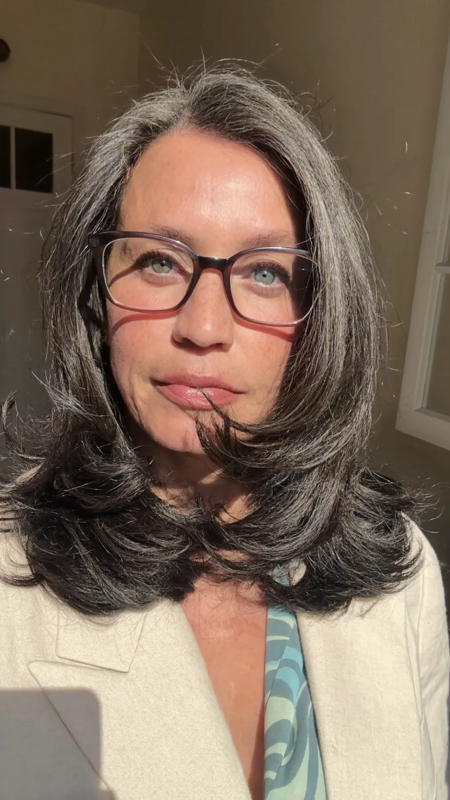 Sophisticated Shoulder-Length Long Layered Hairstyle for Mature Women
