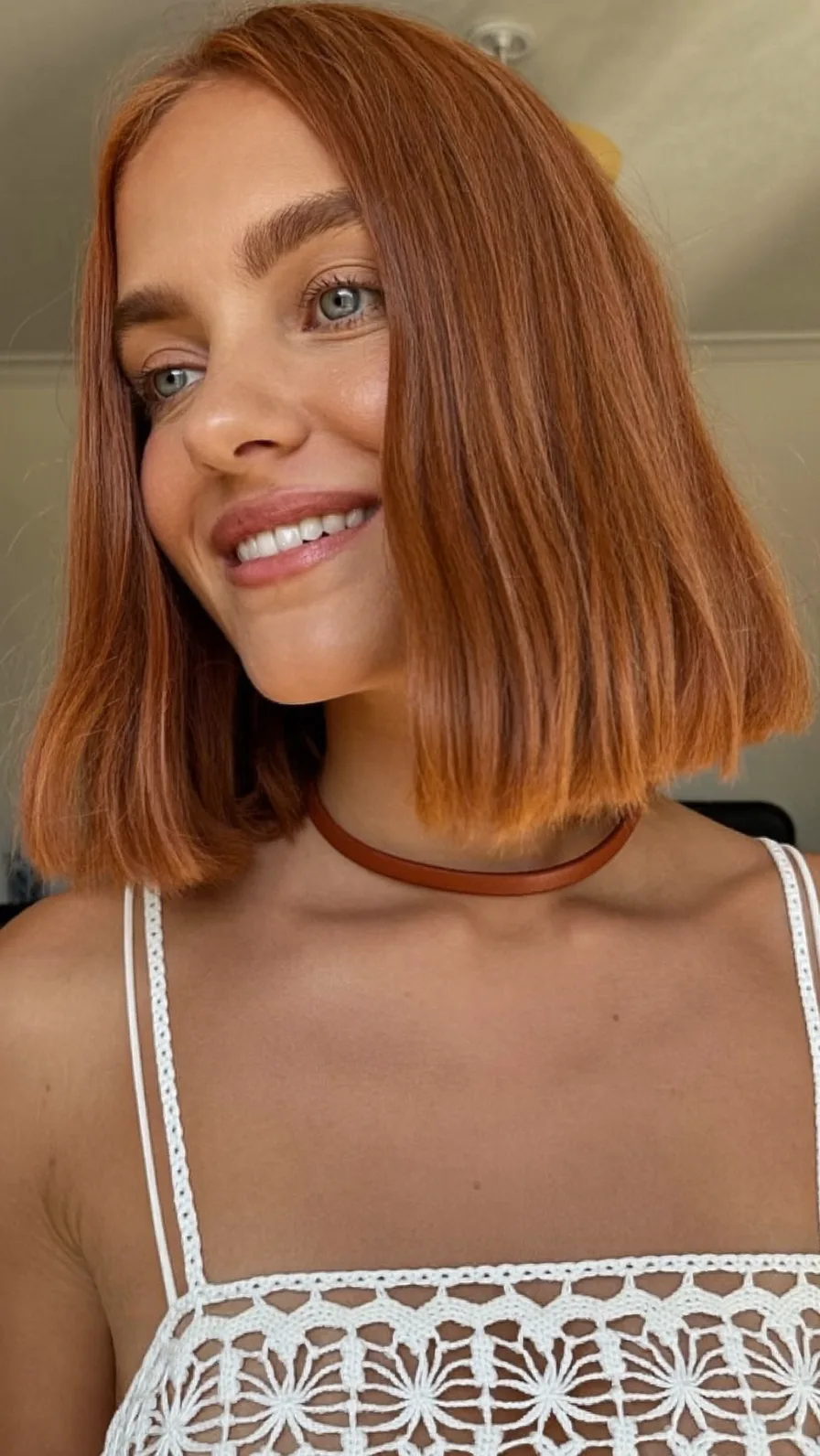 Sleek Warm Copper Chin-Length Blunt Bob Hairstyle