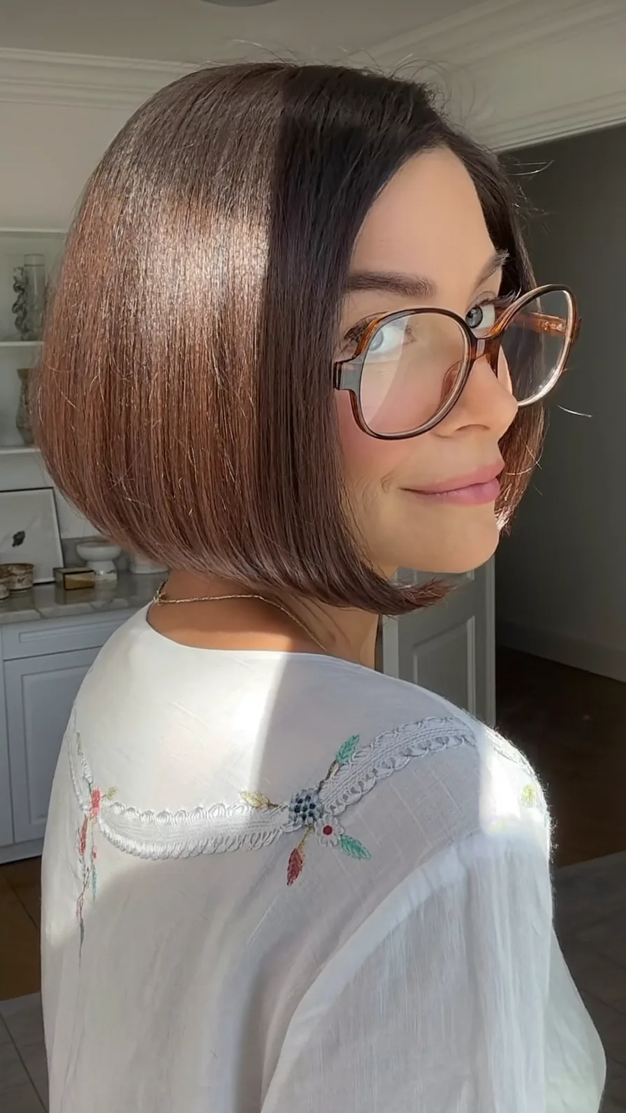 Sleek Chin-Length Blunt Bob with Deep Side Part and Glasses