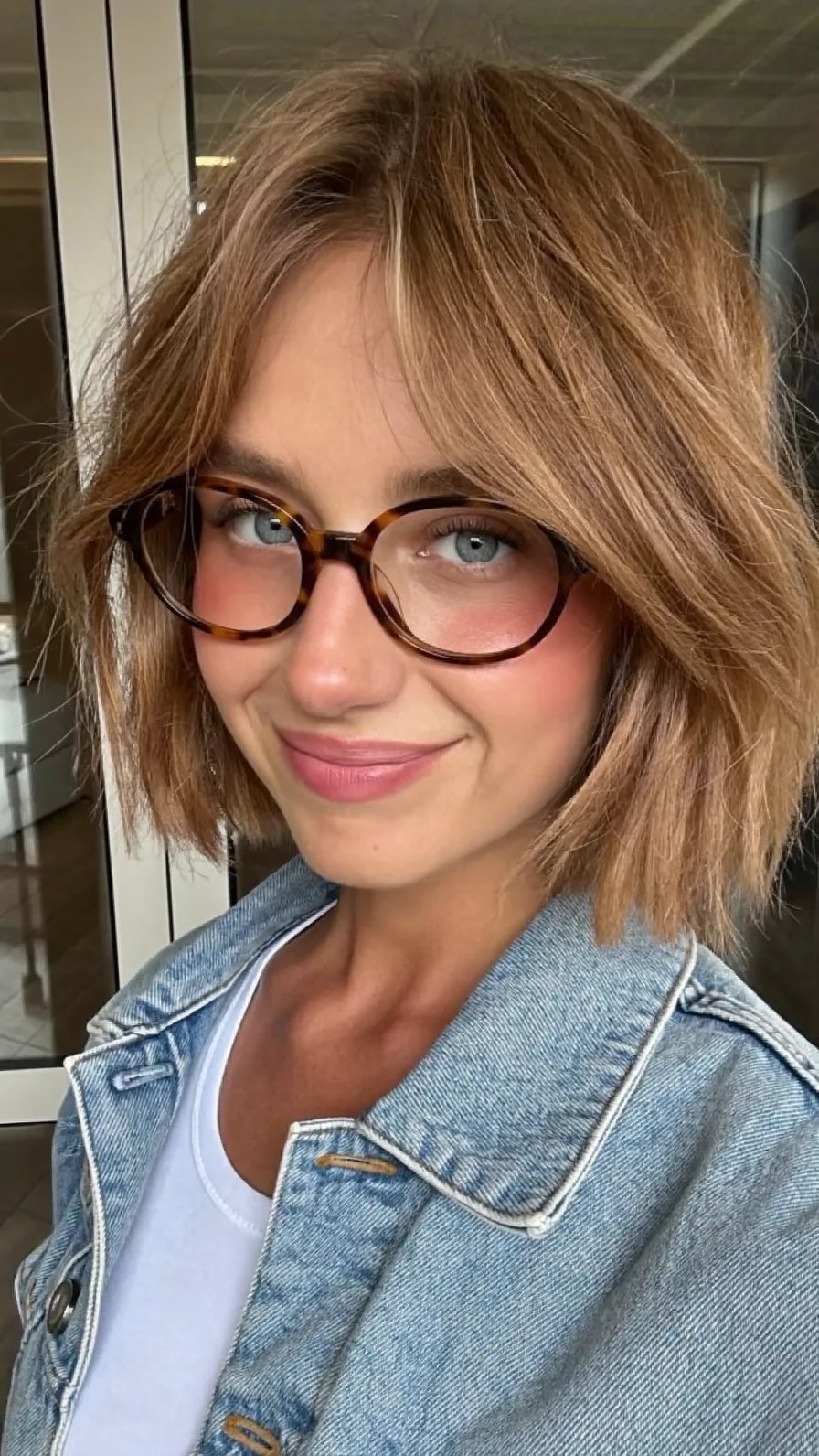 Chic Textured Bob with Curtain Bangs and Honey Blonde Highlights