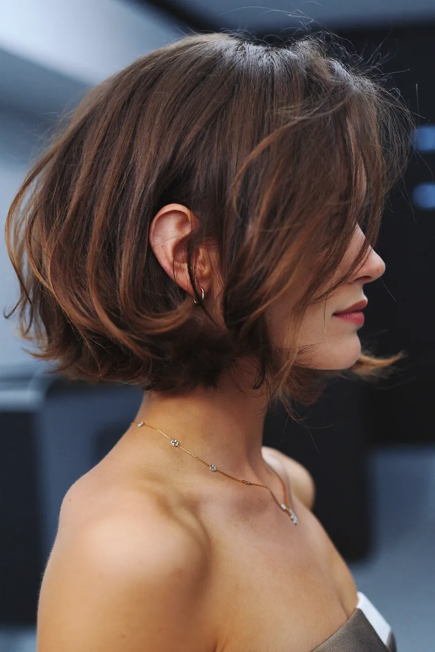 Chin-Length Textured Bob with Side-Swept Bangs and Babylights