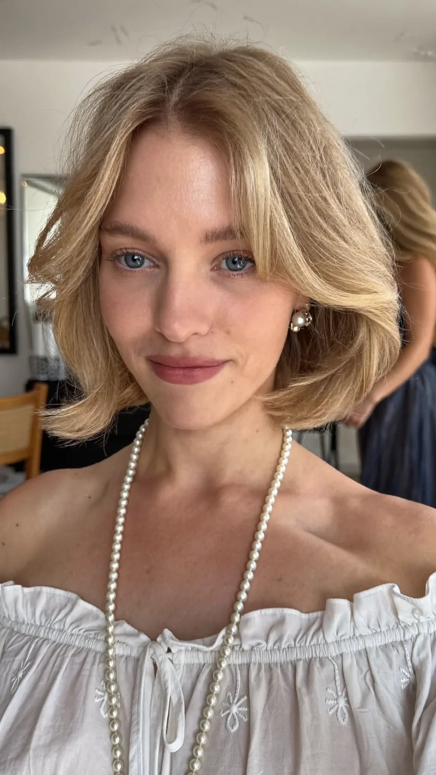 Soft Feathered Chin-Length Bob with Curtain Bangs Style