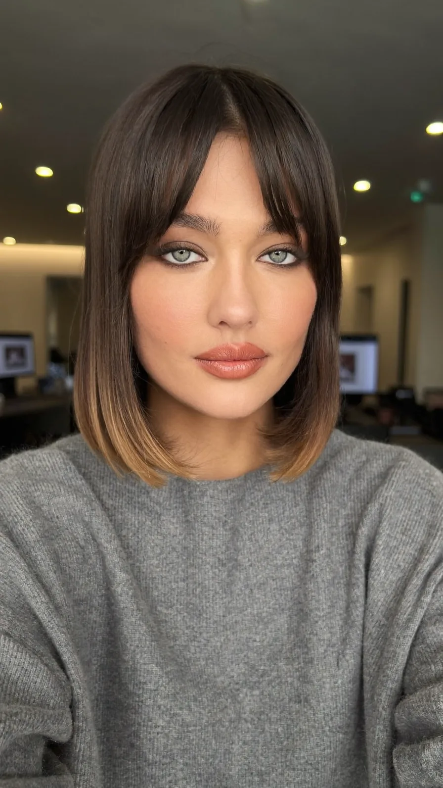 Modern Shoulder-Length Dark Brown Bob with Curtain Bangs