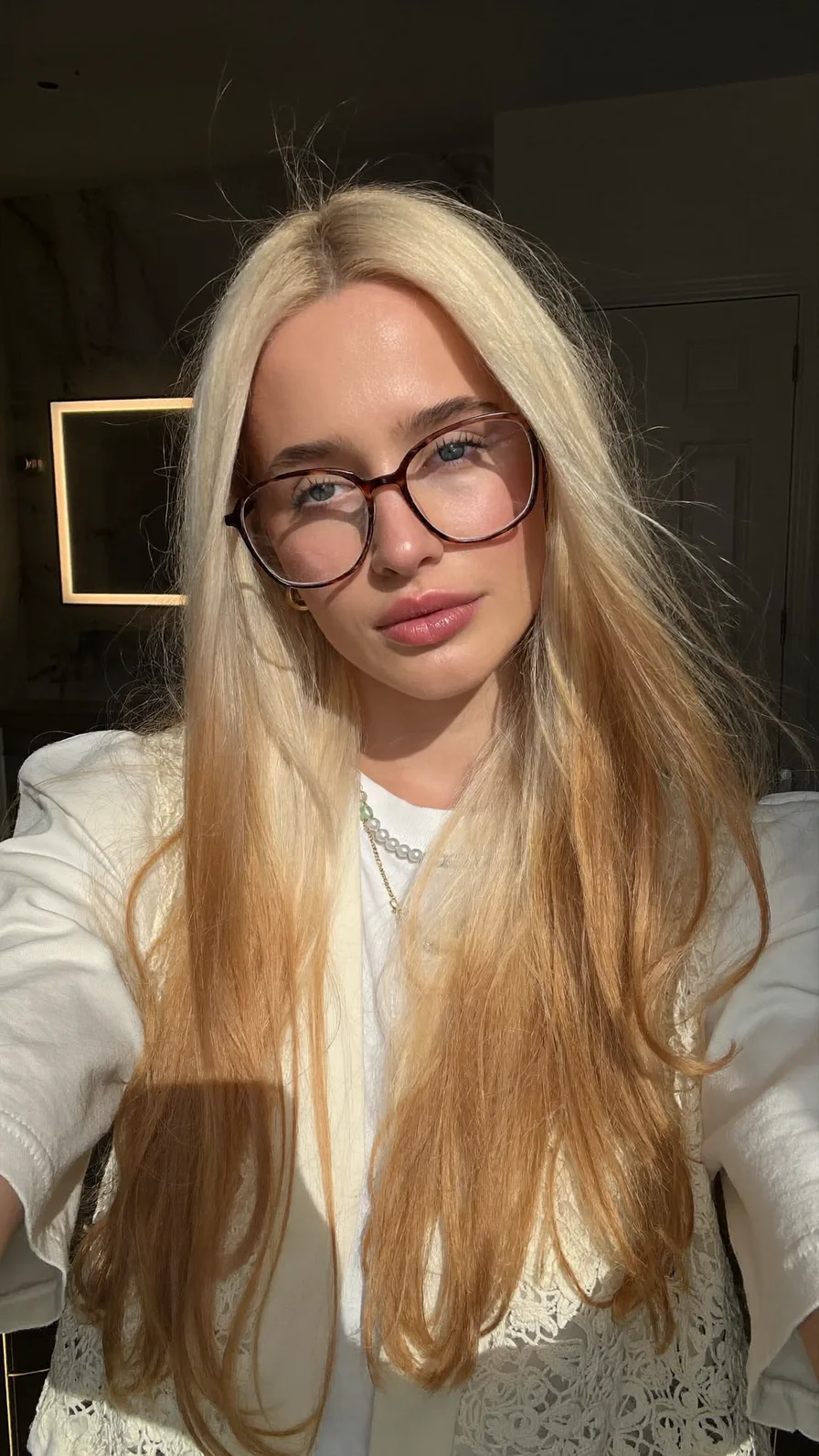 Platinum Blonde Long Layered Hair with Subtle Ombre Effect