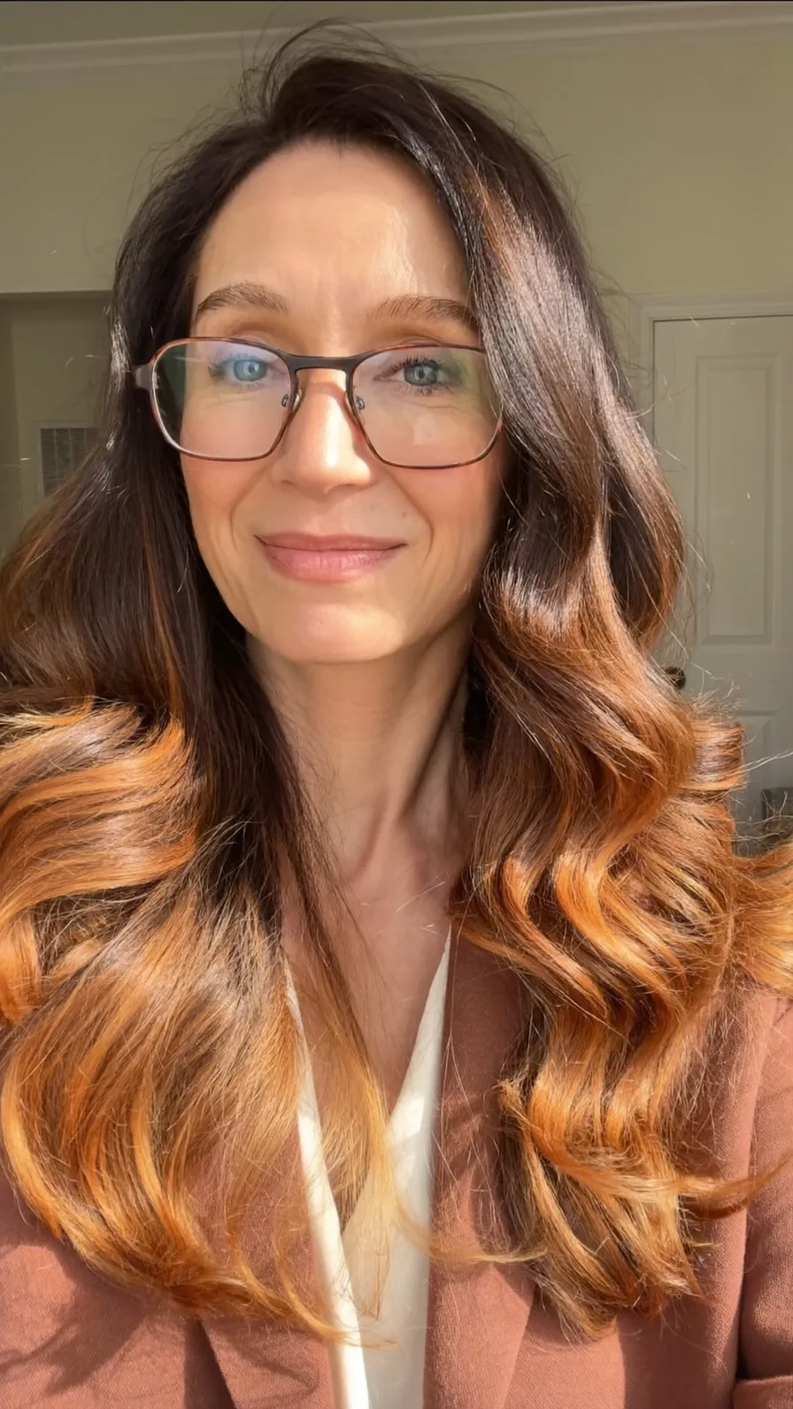 Long Layered Wavy Ombre Hairstyle with Voluminous Flicked Ends