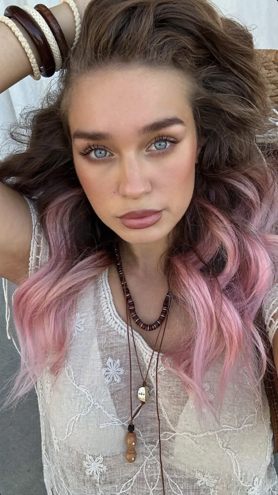 Voluminous Long Layers with Pastel Pink Ombre Effect