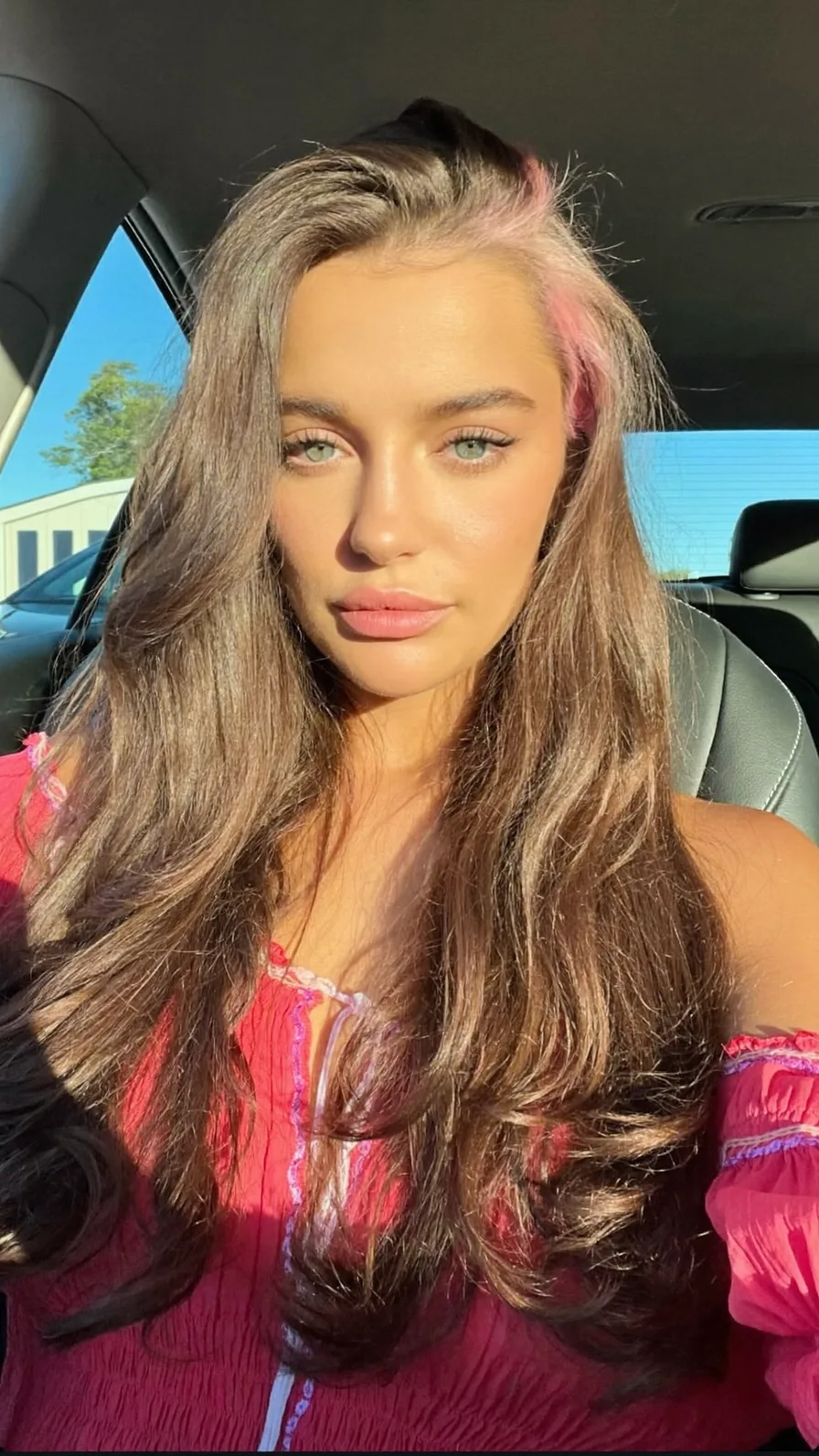 Voluminous Long Layers with Pink Peekaboo Money Piece Highlights