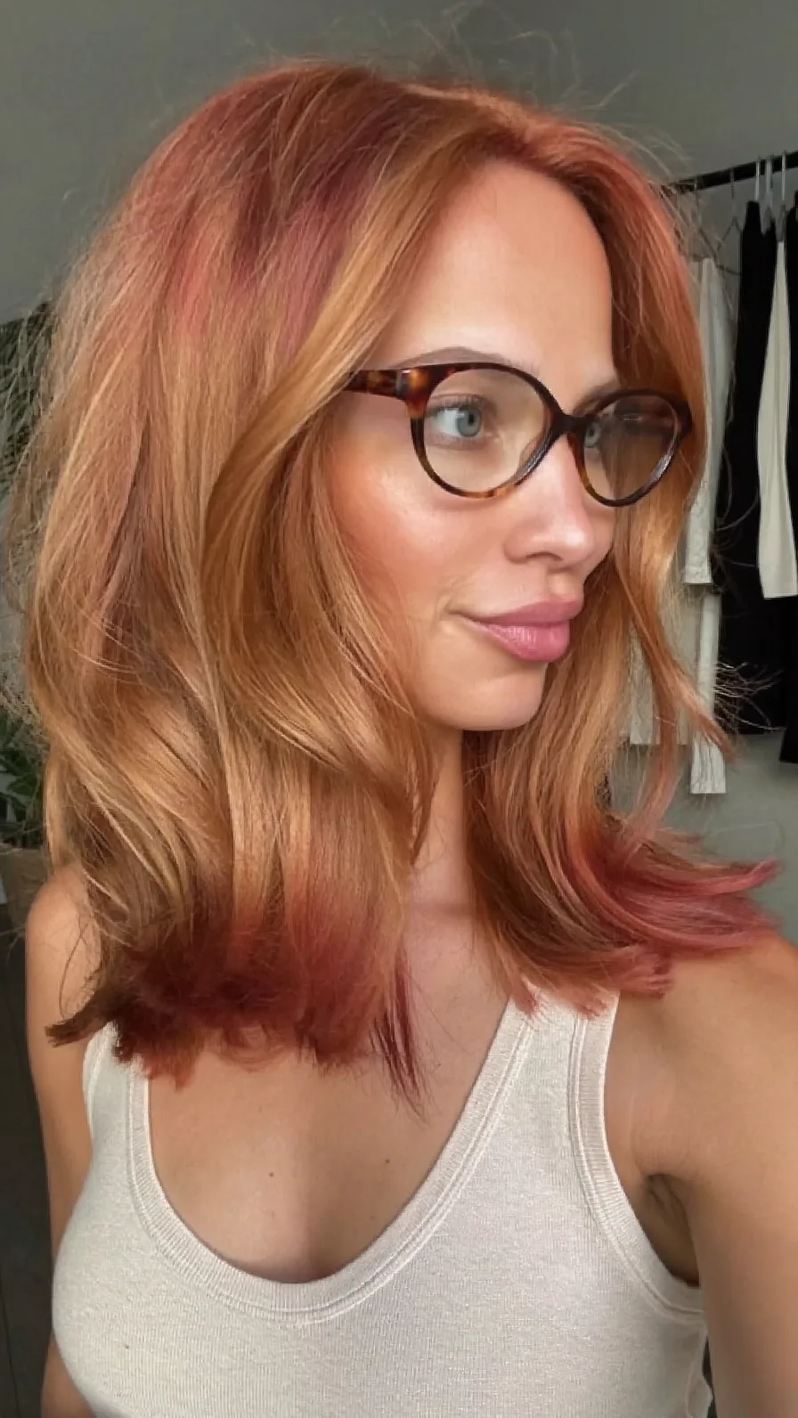 Modern Copper Medium-Length Layered Hairstyle with Side Swept Bangs