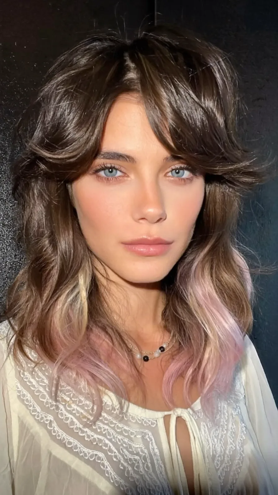 Medium Wavy Hair with Curtain Bangs and Pastel Tips