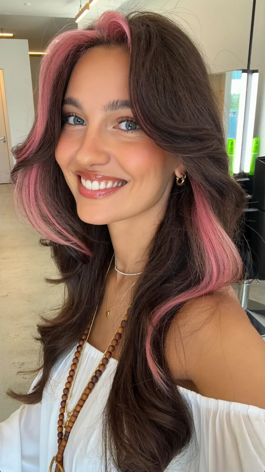 Voluminous Long Layers with Pink Money-Piece and Feathered Curtain Bangs