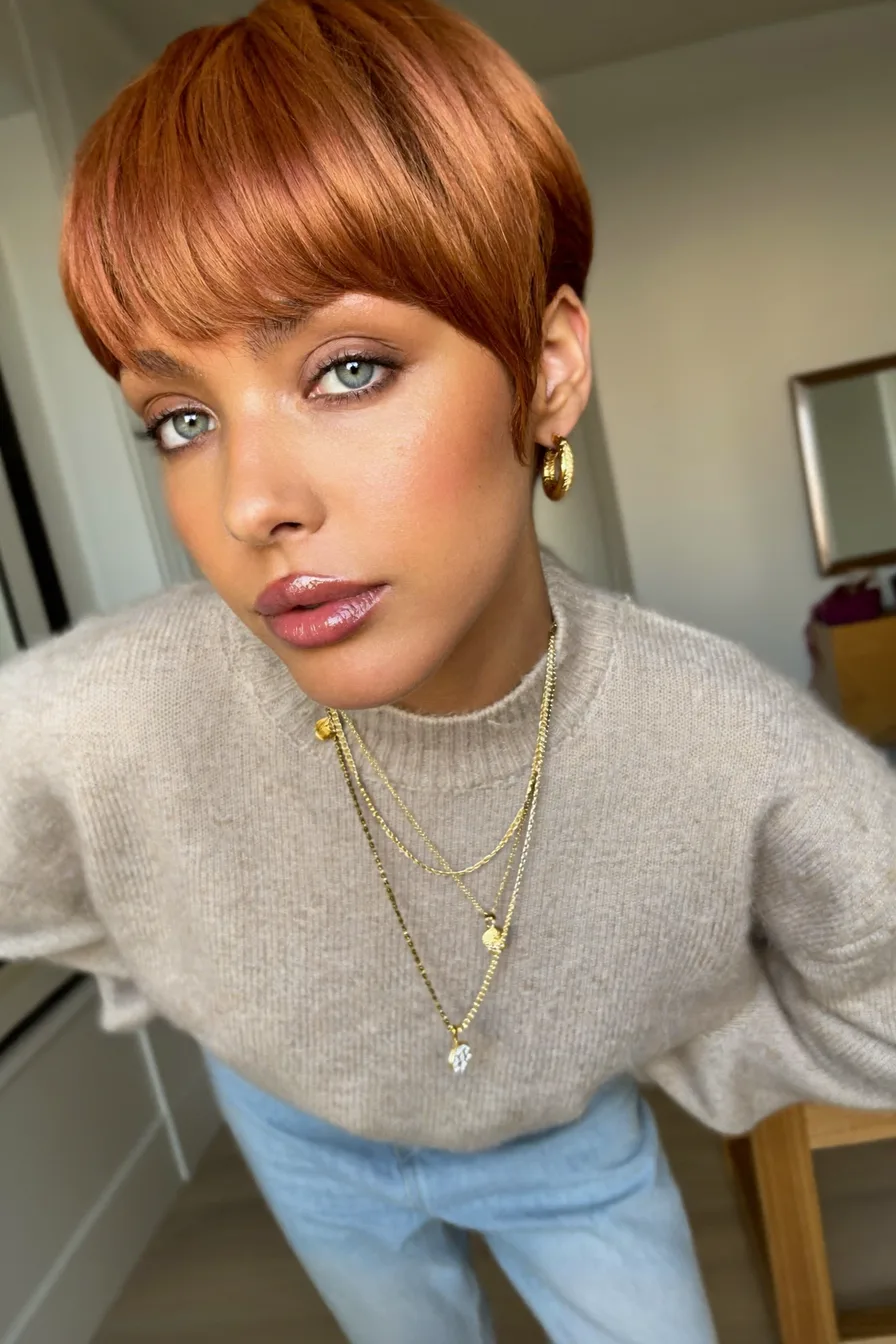 Sleek Copper Pixie-Bob With Blunt Bangs for a Modern Look