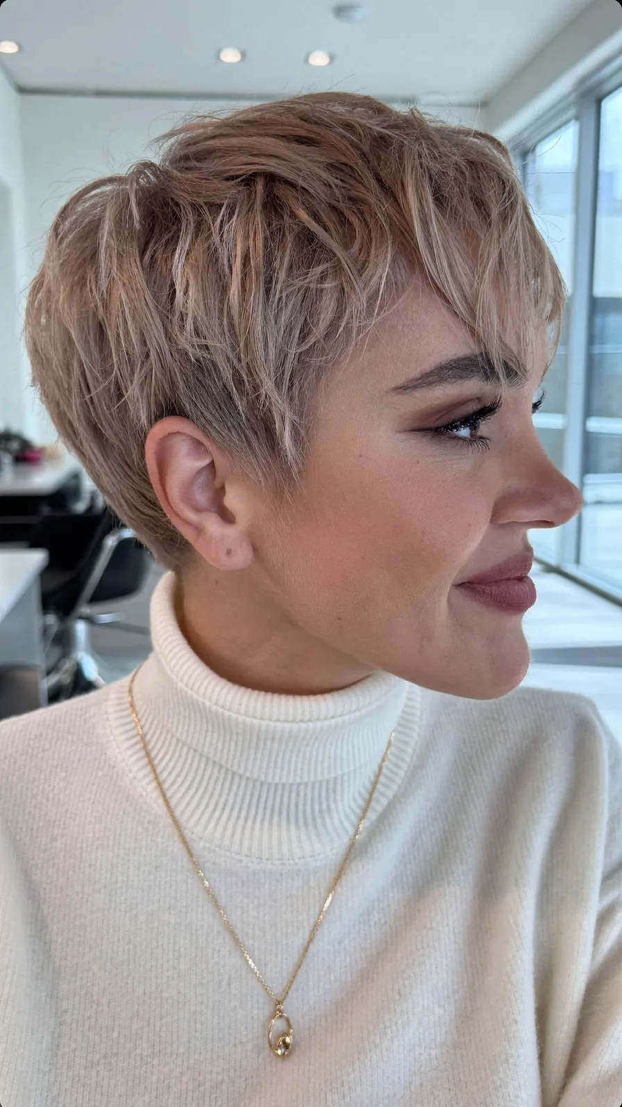 Textured Blonde Pixie-Bob With Side-Swept Bangs And Volume