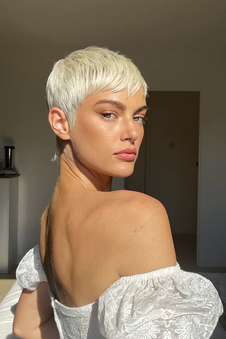 Edgy Platinum Pixie-Bob Cut with Textured Fringe Accents
