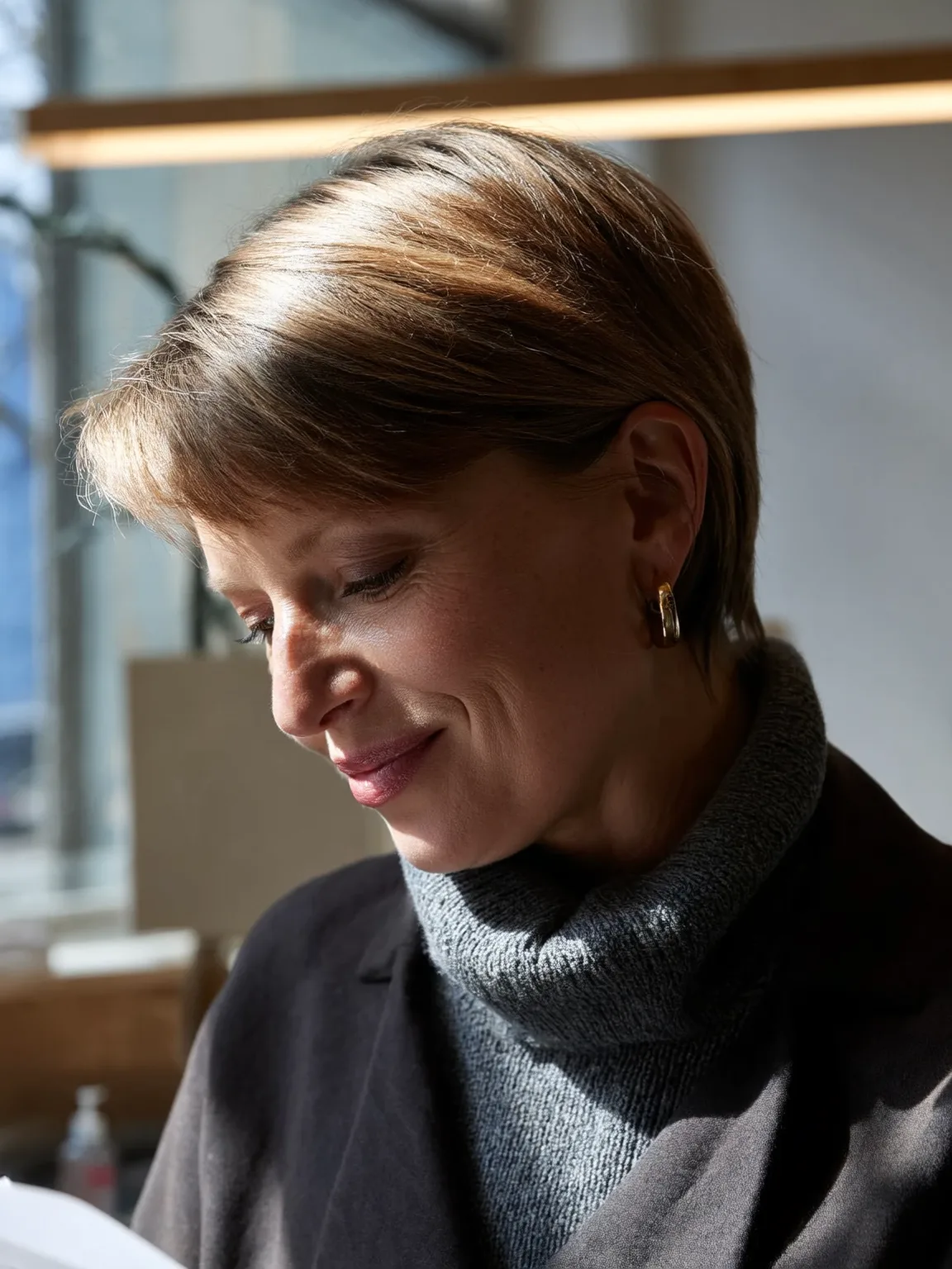 Warm Caramel Pixie with Sleek Side-Swept Bangs