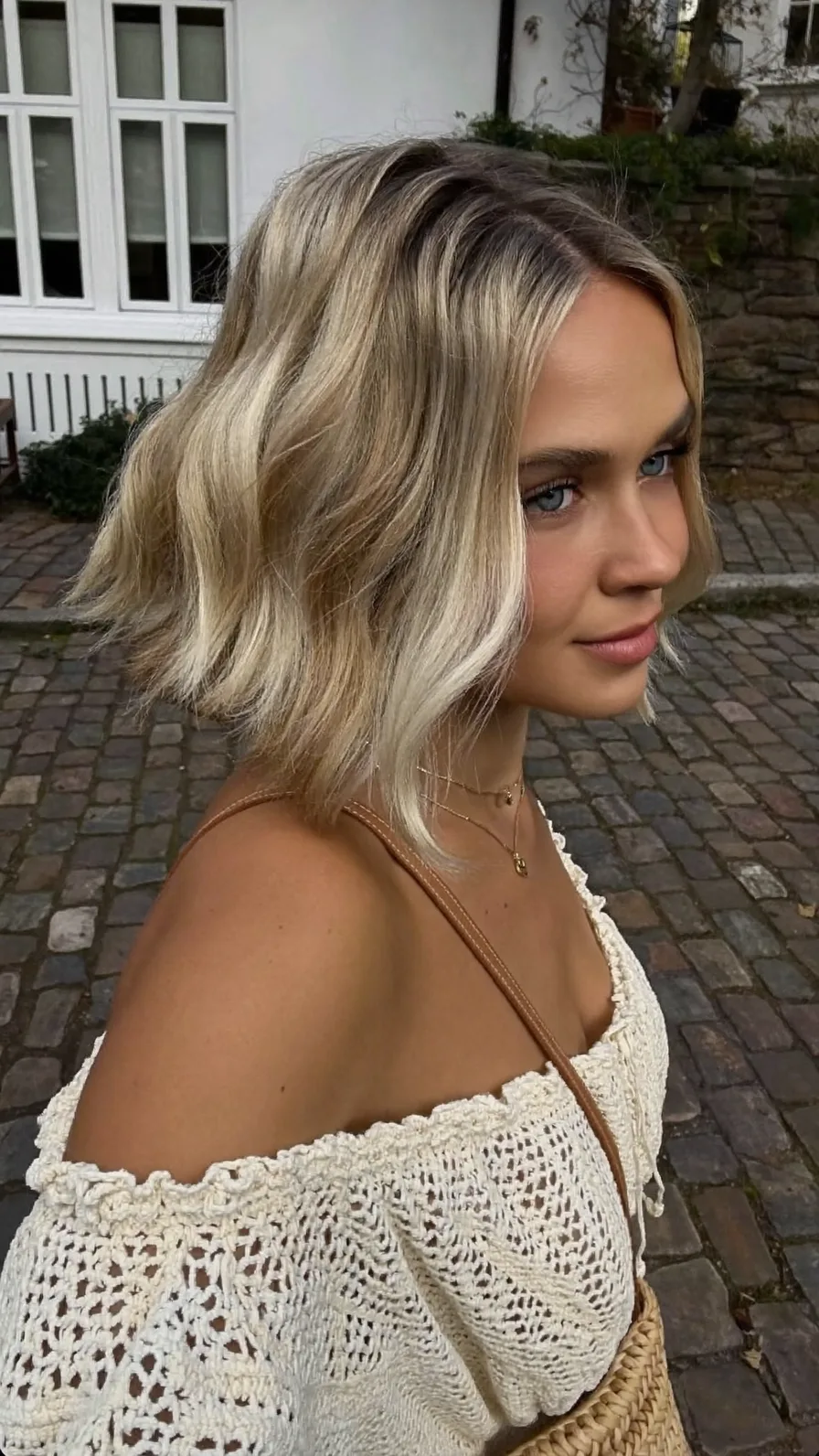 Chic Ash Blonde Wavy Bob with Side-Swept Balayage Highlights