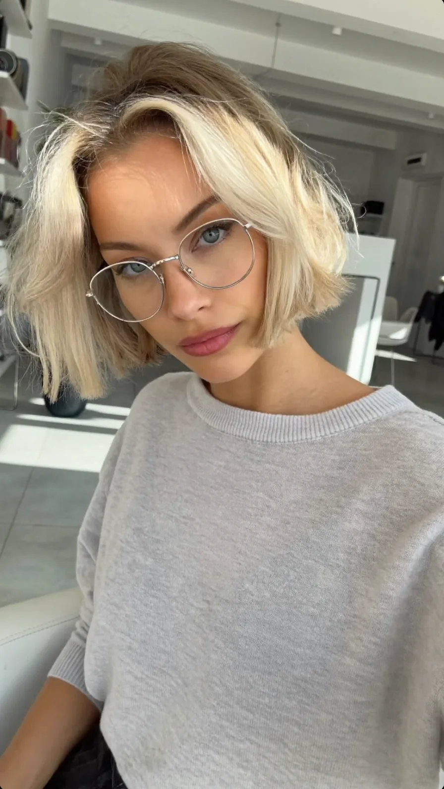 Modern Textured Platinum Blonde Bob with Side-Swept Bangs