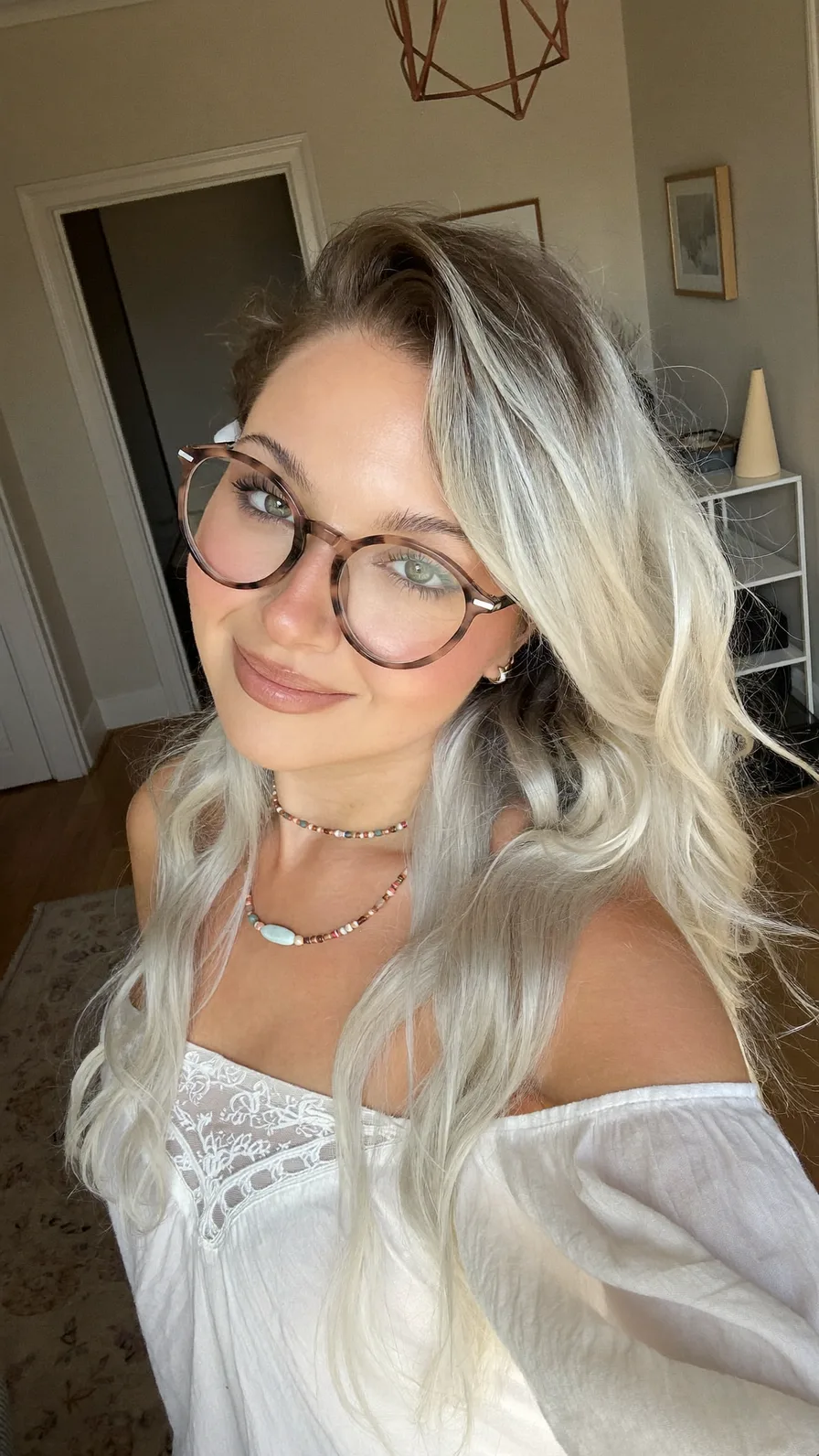 Soft Platinum Blonde Long Layers with Side-Swept Volume
