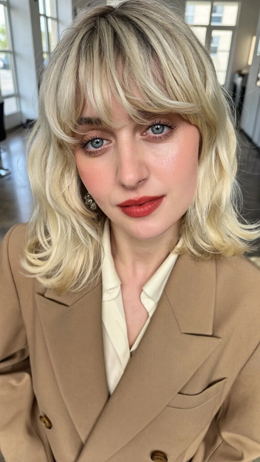 Modern Shoulder-Length Lob with Curtain Bangs and Flicked Ends
